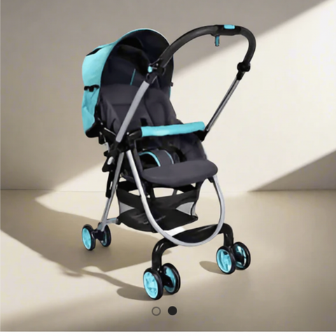 Turquoise baby stroller - beige background